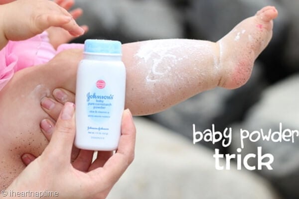 Rubbing baby powder on sandy leg