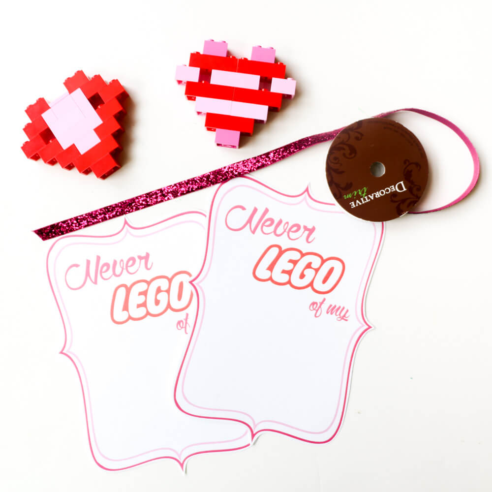 DIY LEGO Heart Valentines - The kids will love helping make these "Never LEGO of my" heart Valentines for their friends, with free printables included!