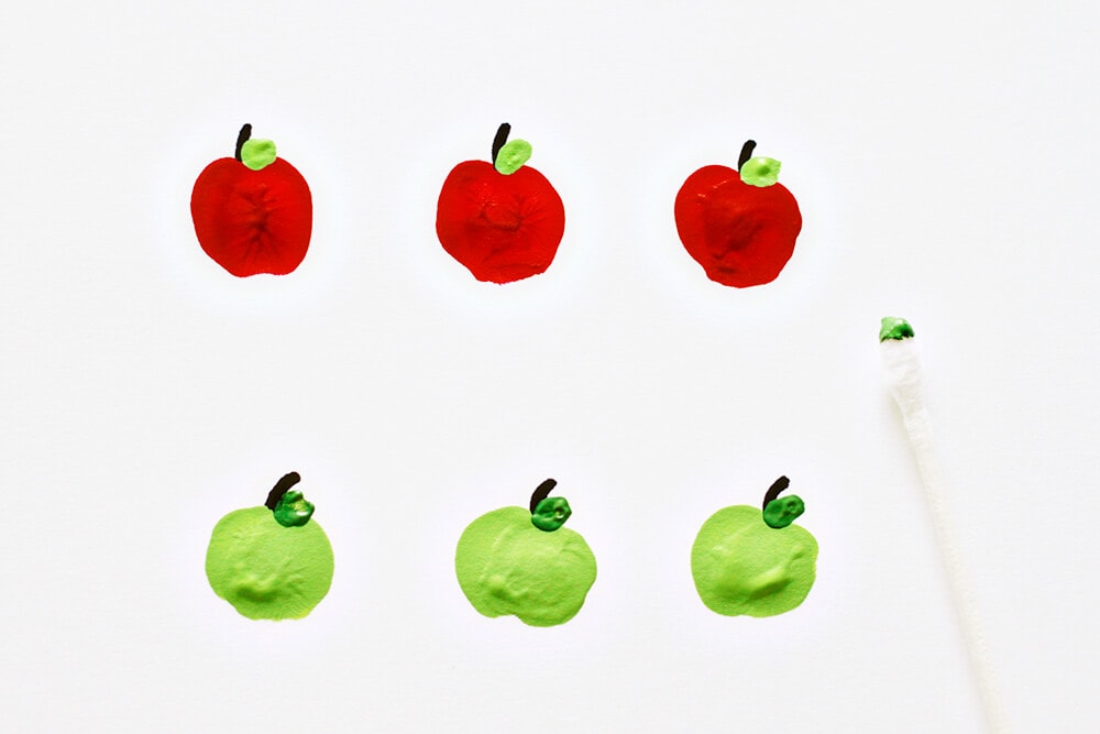 Apple Fingerpaint Bowls... adding leaves to the apples