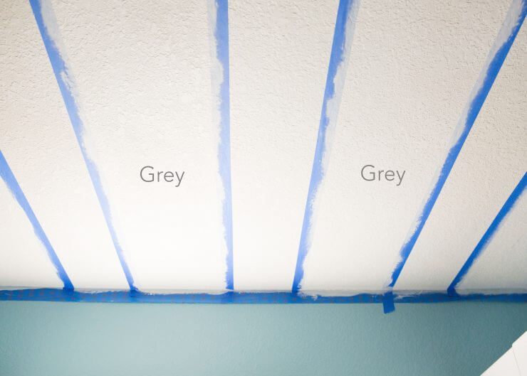 How to Paint a Striped Ceiling ... an unexpected striped ceiling in the laundry room is the perfect pop of surprise in a much-used room that helps making laundry more fun!