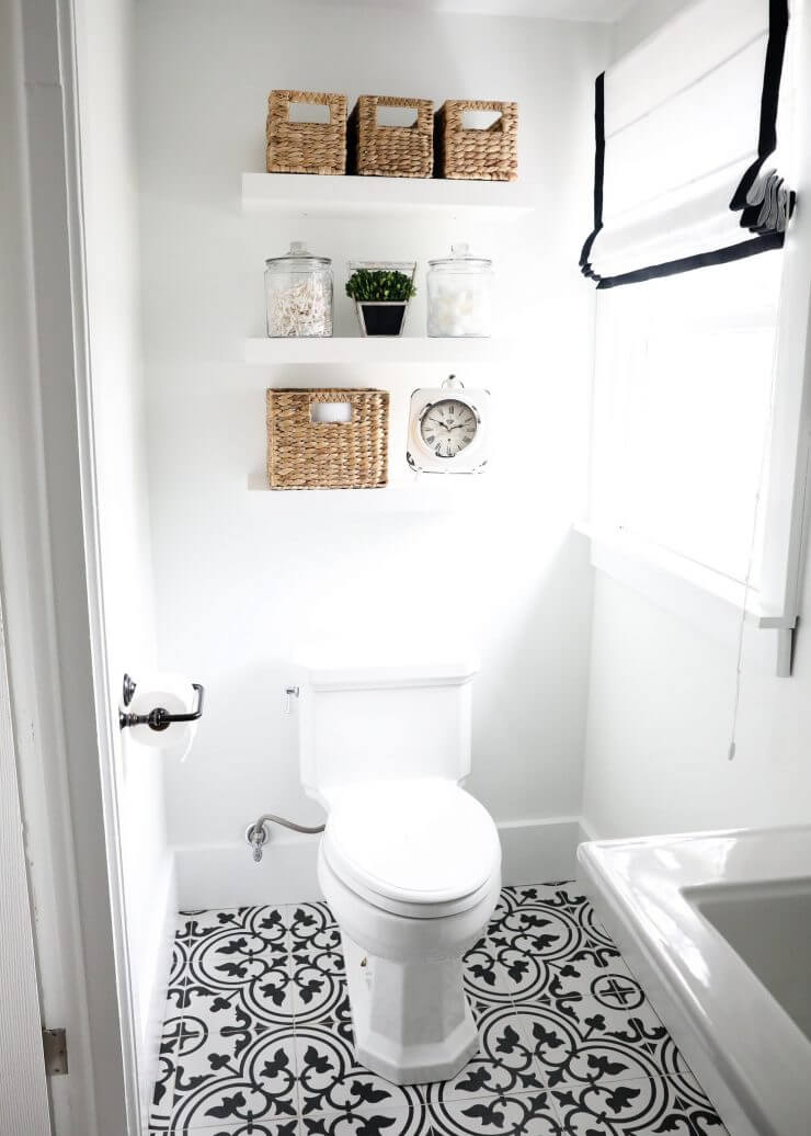 Black and white bathroom makeover on a 1888 fixer upper: white subway tile, oil rubbed bronze finishes + cement tile 