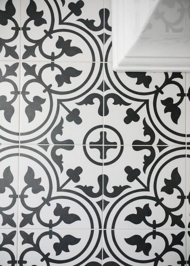 Black and white bathroom makeover on a 1888 fixer upper: white subway tile, oil rubbed bronze finishes + cement tile 