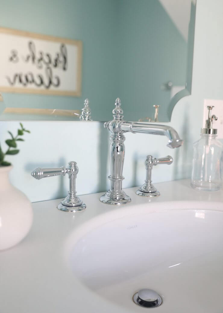 Fixer Upper Bathroom Before and Afters... fixer upper style bathroom makeover with clawfoot tub, watery paint color and sliding barn door.