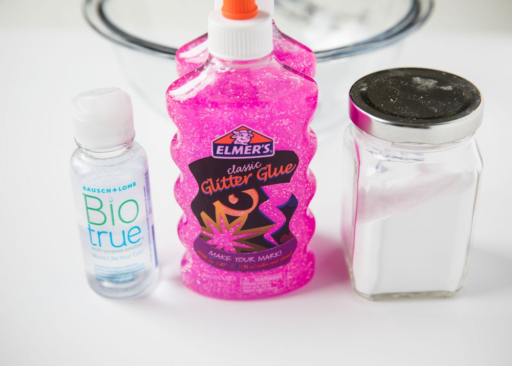 ingredients for glitter glue slime on counter 