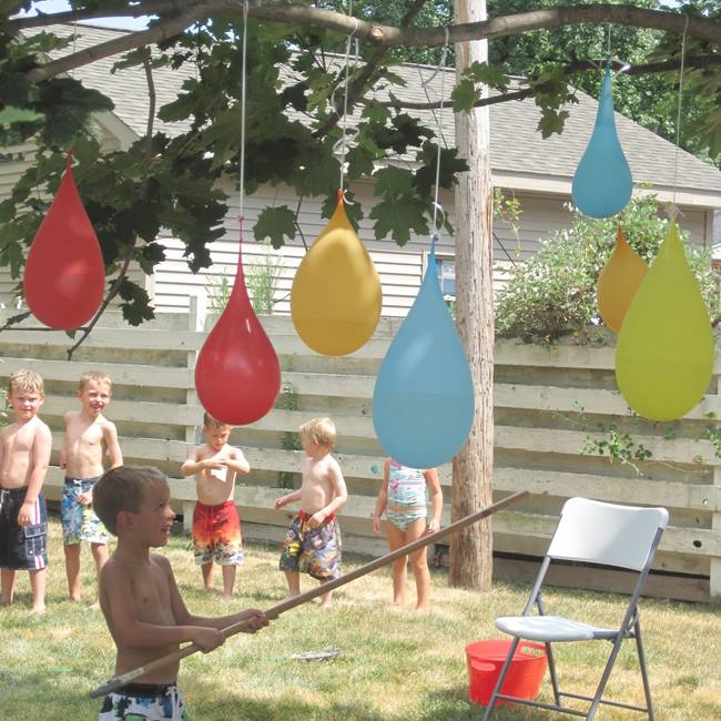 Kids and hanging water balloons