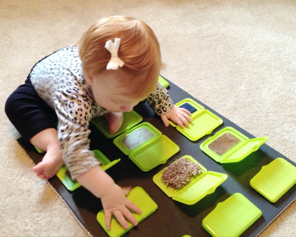 Sensory game with wipe container lids