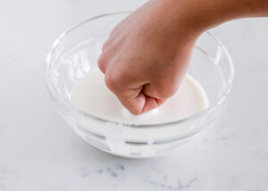 pounding oobleck in bowl
