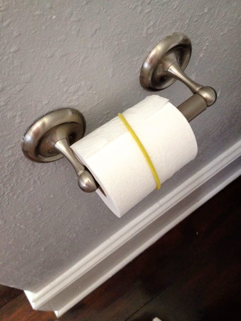 Toilet Paper with a hair band around it