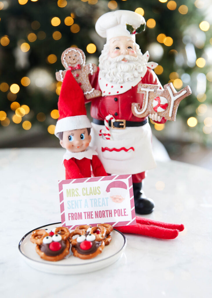 elf on the shelf next to plate of treats