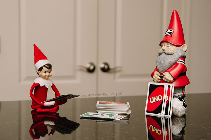 Elf playing uno with a gnome. 