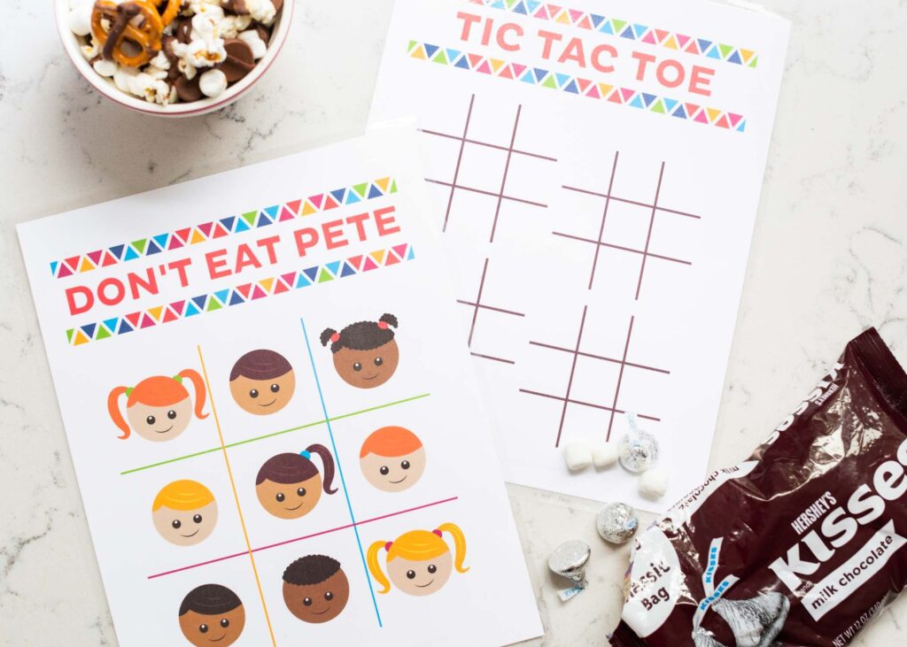 Fun Indoor Activities for Kids at Home...fantastic ideas to help keep your little ones busy all afternoon. Creative and fun activities that everyone will love. Don't Eat Pete and Tic Tac Toe printable on a White table with candy