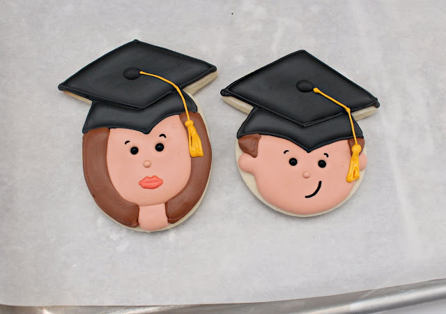 Sugar Cookies with faces and graduation caps