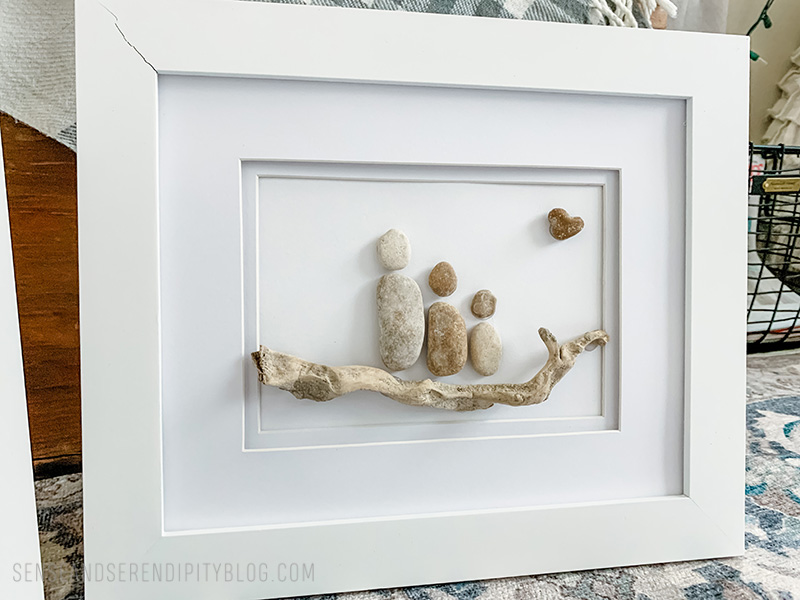 Rock collage of a family in a picture frame
