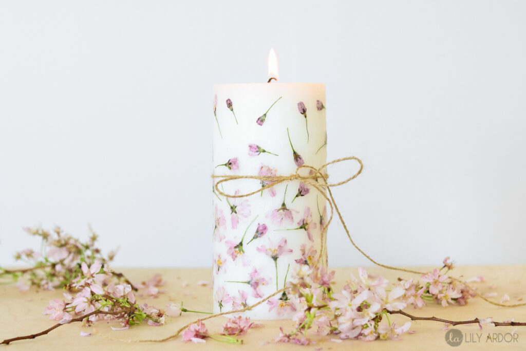 Real flowers on a white candle