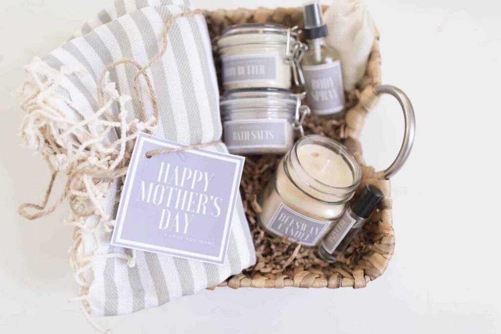 Candle, Towel, and other relaxing spa products in a brown woven basket