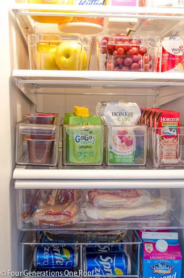 A refrigerator organized using plastic bins