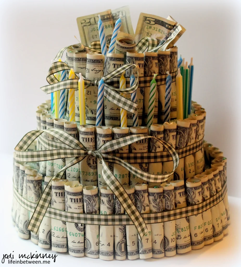 Money birthday cake on counter.